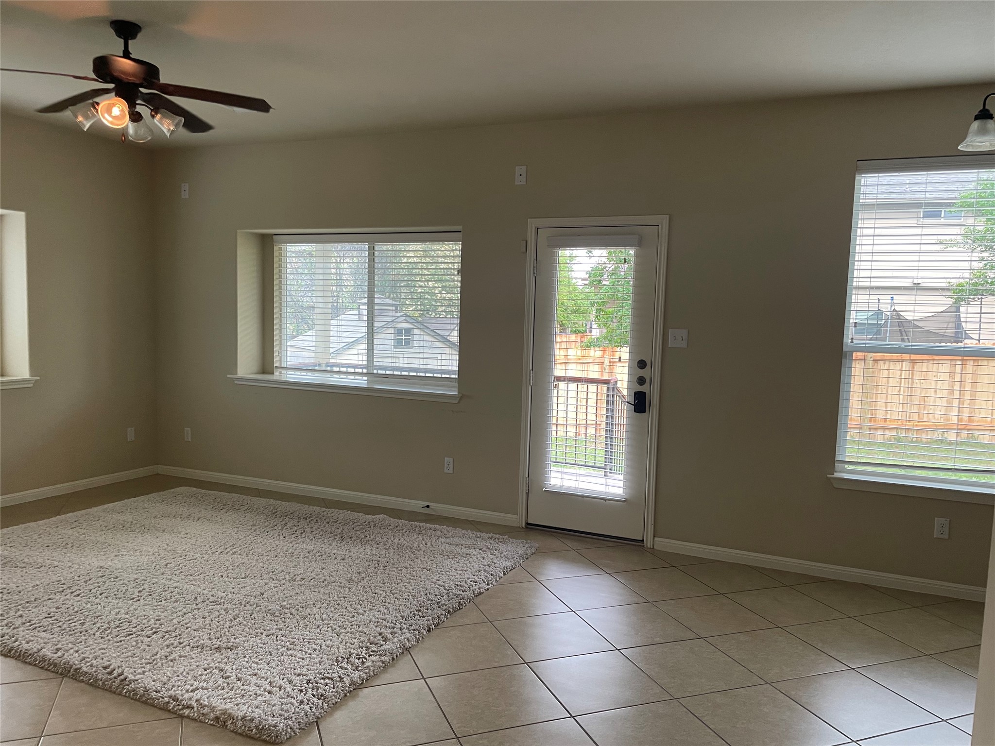 102 Sandy Lyle Cove Round Rock, TX 78664 - Photo 8 of 38 a view of an empty room with a window