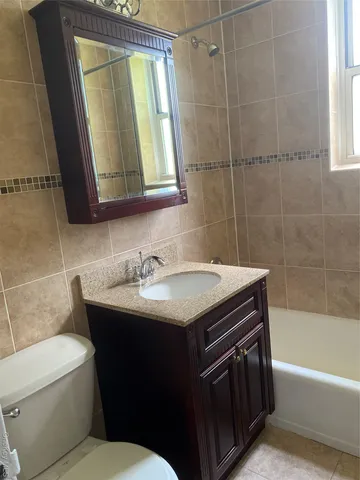 a bathroom with a sink a toilet and a bathtub