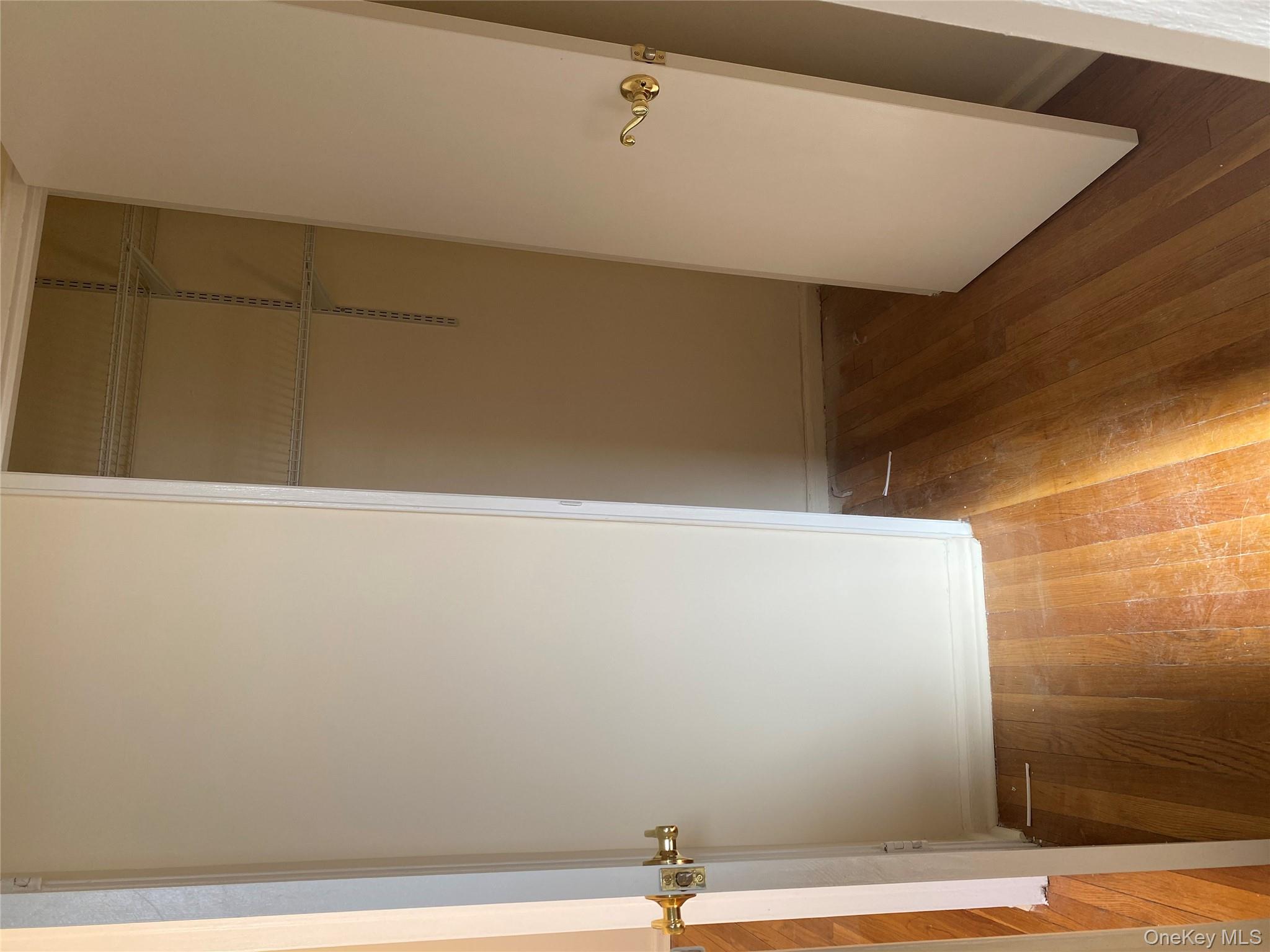 50 South Middle Neck Road, Unit 1B Great Neck, NY 11021 - Photo 8 of 11 a view of hallway with wooden floor