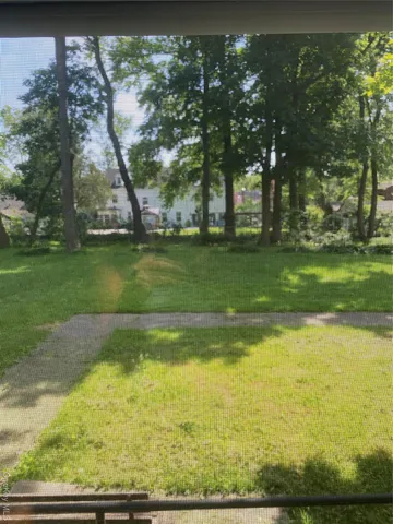 a view of a swimming pool with an outdoor space and seating area