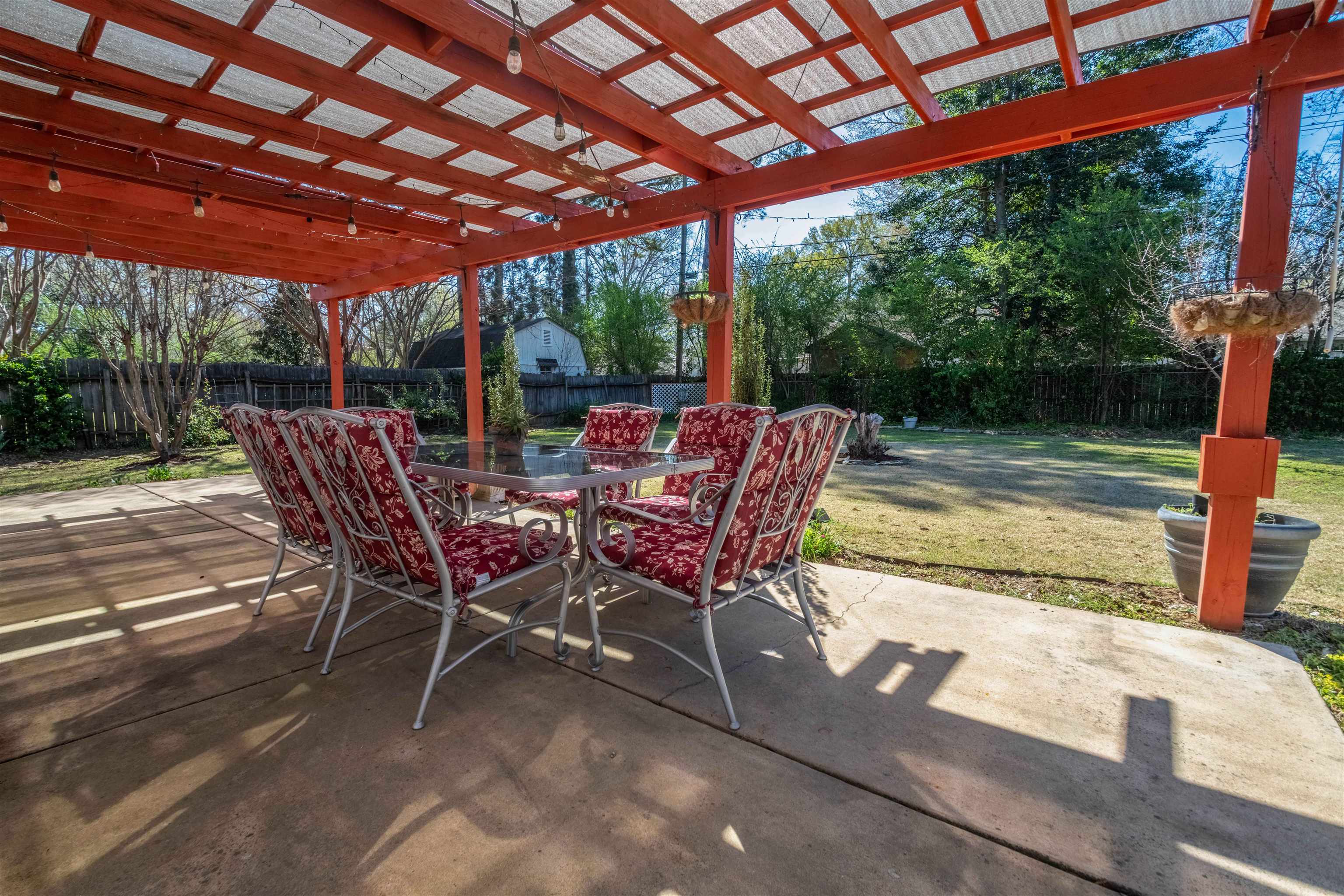 5099 Walnut Grove Road Memphis, TN 38117 - Photo 23 of 24 Fenced backyard featuring a patio area and outdoor dining area