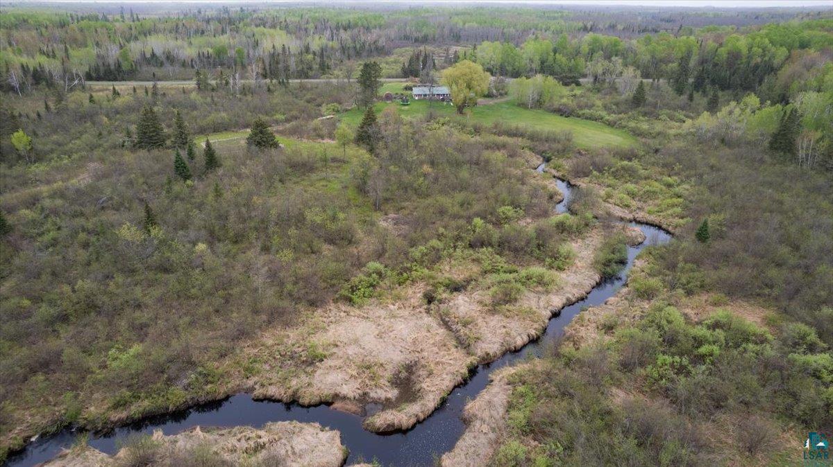 5190 County Road M Gordon, WI 54838 - Photo 2 of 31 Expansive natural landscape featuring a winding waterway and dense shrubbery