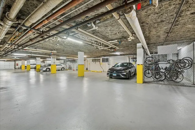 a view of parking garage with parked cars