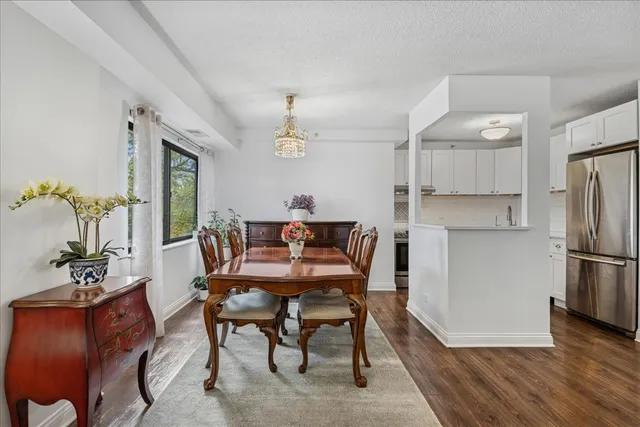 a dining room with furniture and wooden floor