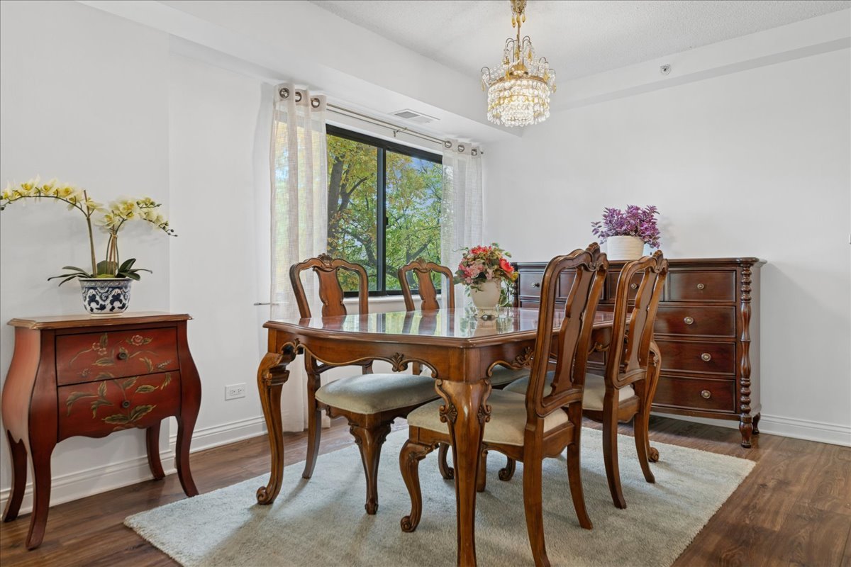 1800 Huntington Boulevard, Unit 212 Hoffman Estates, IL 60169 - Photo 7 of 15 a view of a dining room with furniture window and outside view