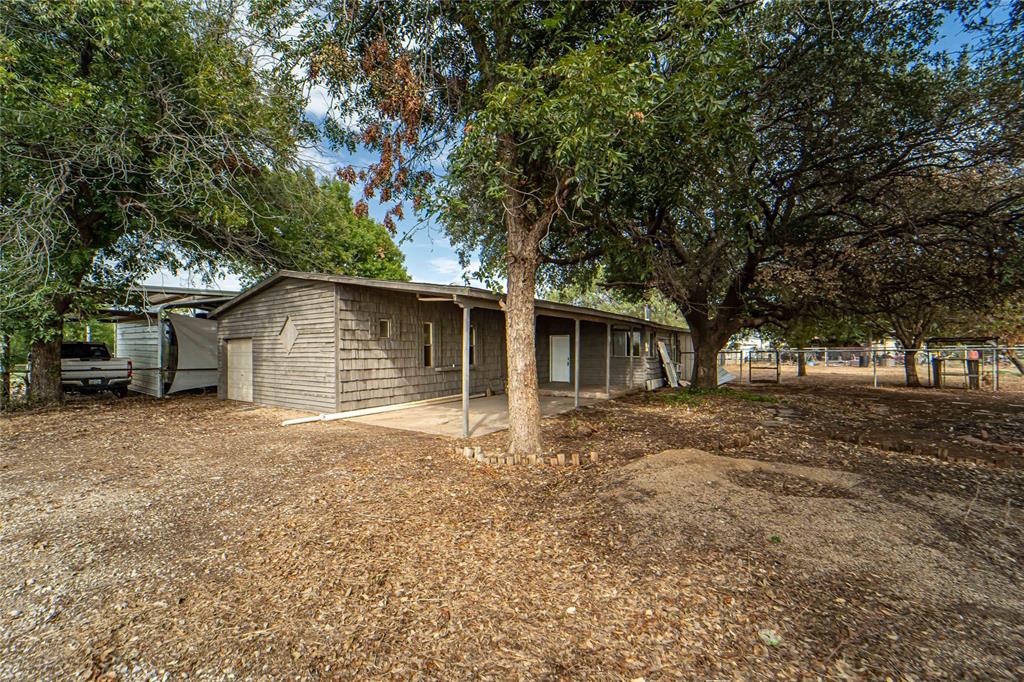 122 County Road 306 Breckenridge, TX 76424 - Photo 29 of 40 a house with trees in the background