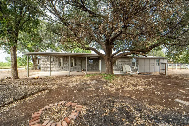 front view of a house with a trees