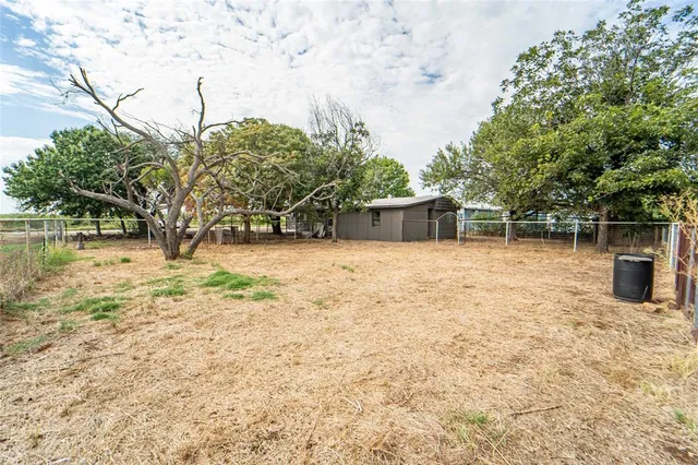 front view of house with a trees