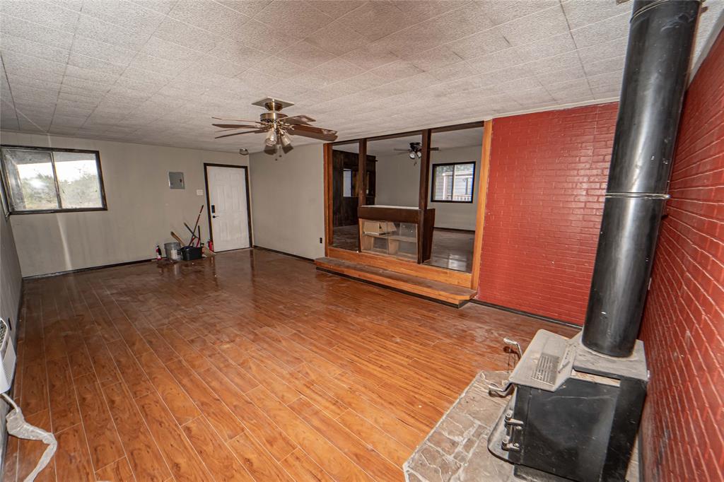 122 County Road 306 Breckenridge, TX 76424 - Photo 10 of 40 a view of a livingroom with furniture and a ceiling fan