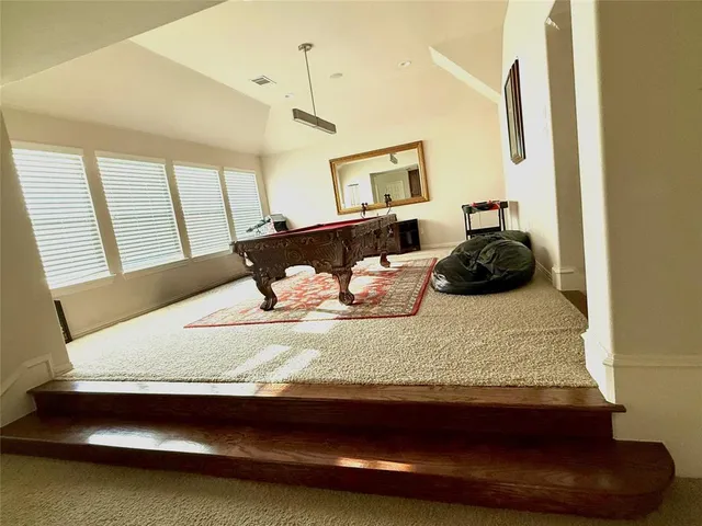 a living room with hard wood flooring