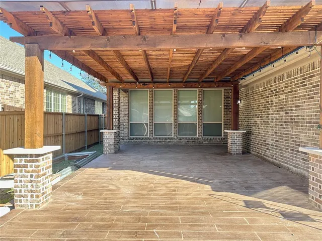 a view of a water heater room with wooden walls