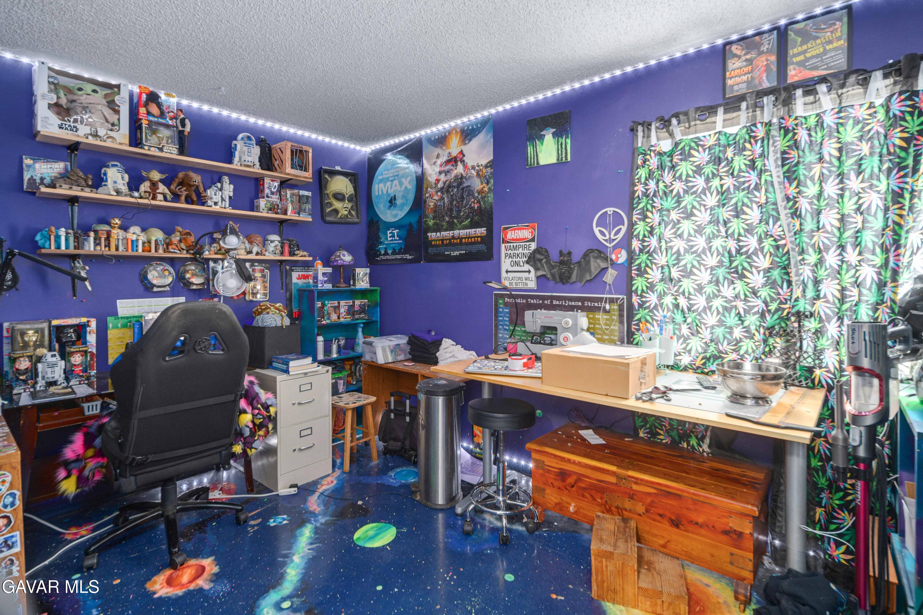 3112 Myrtle Street Rosamond, CA 93560 - Photo 19 of 49 a room with furniture and a book shelf