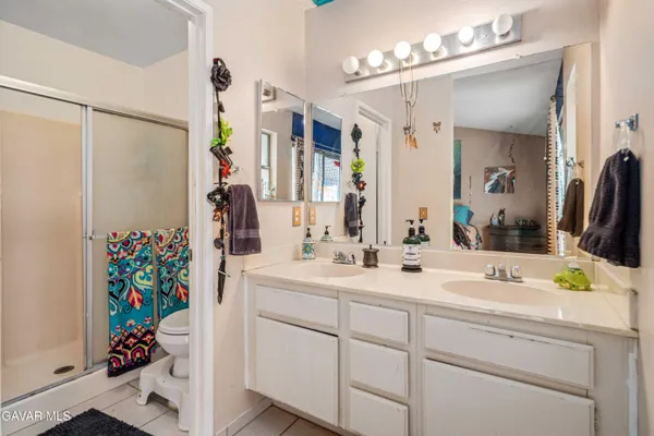 a view of a patio with table and chairs and potted plants