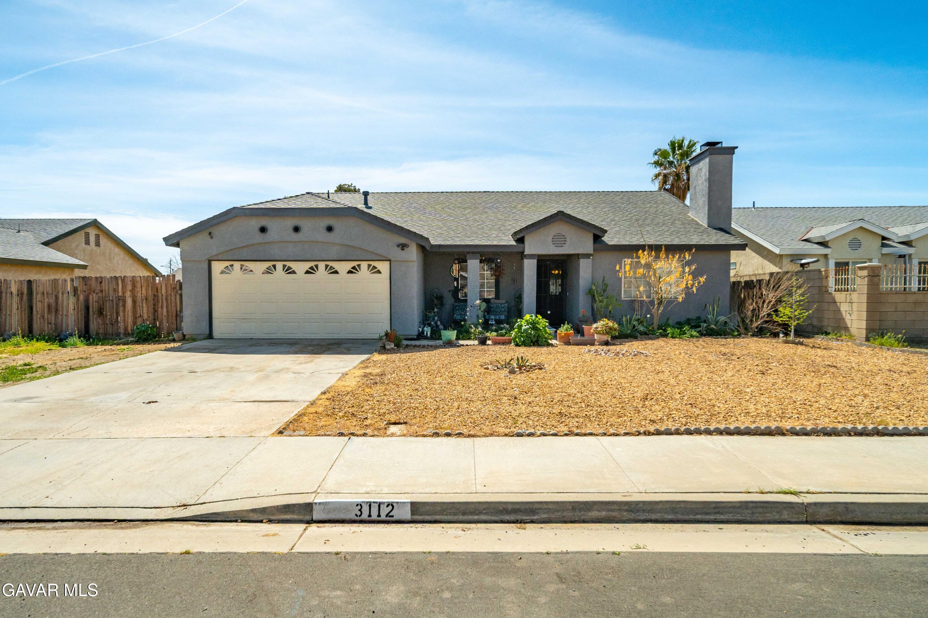 3112 Myrtle Street Rosamond, CA 93560 - Photo 2 of 49 a front view of a house with a yard