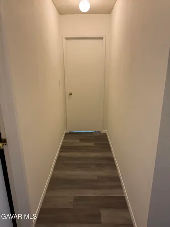 a swimming pool with some trees in the background