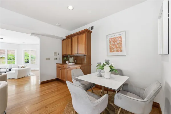 a living room with a large window and a glass door shower