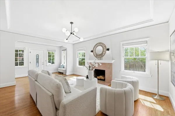 a view of a dining room with furniture window and wooden floor