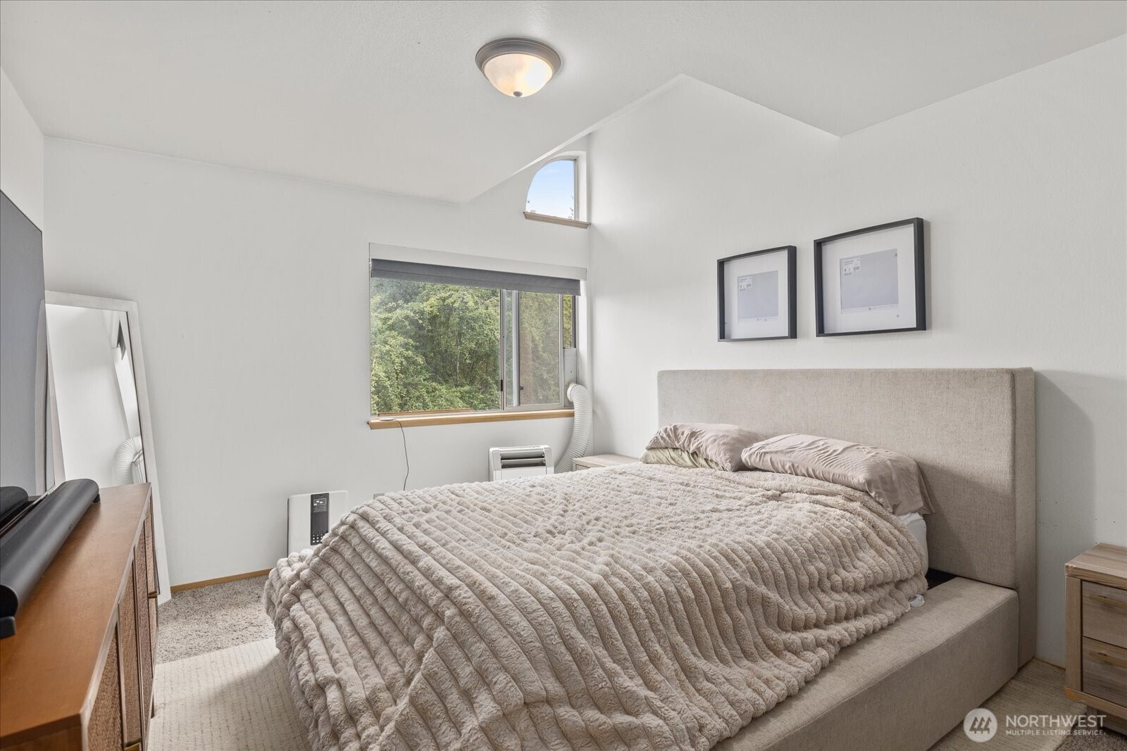 2826 Northeast 8th Street Renton, WA 98056 - Photo 12 of 20 a bedroom with a large bed and a window