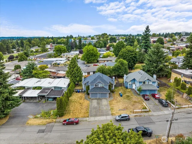 an aerial view of residential houses with outdoor space