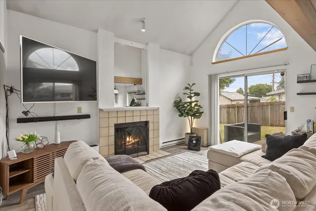 a living room with furniture and a fireplace