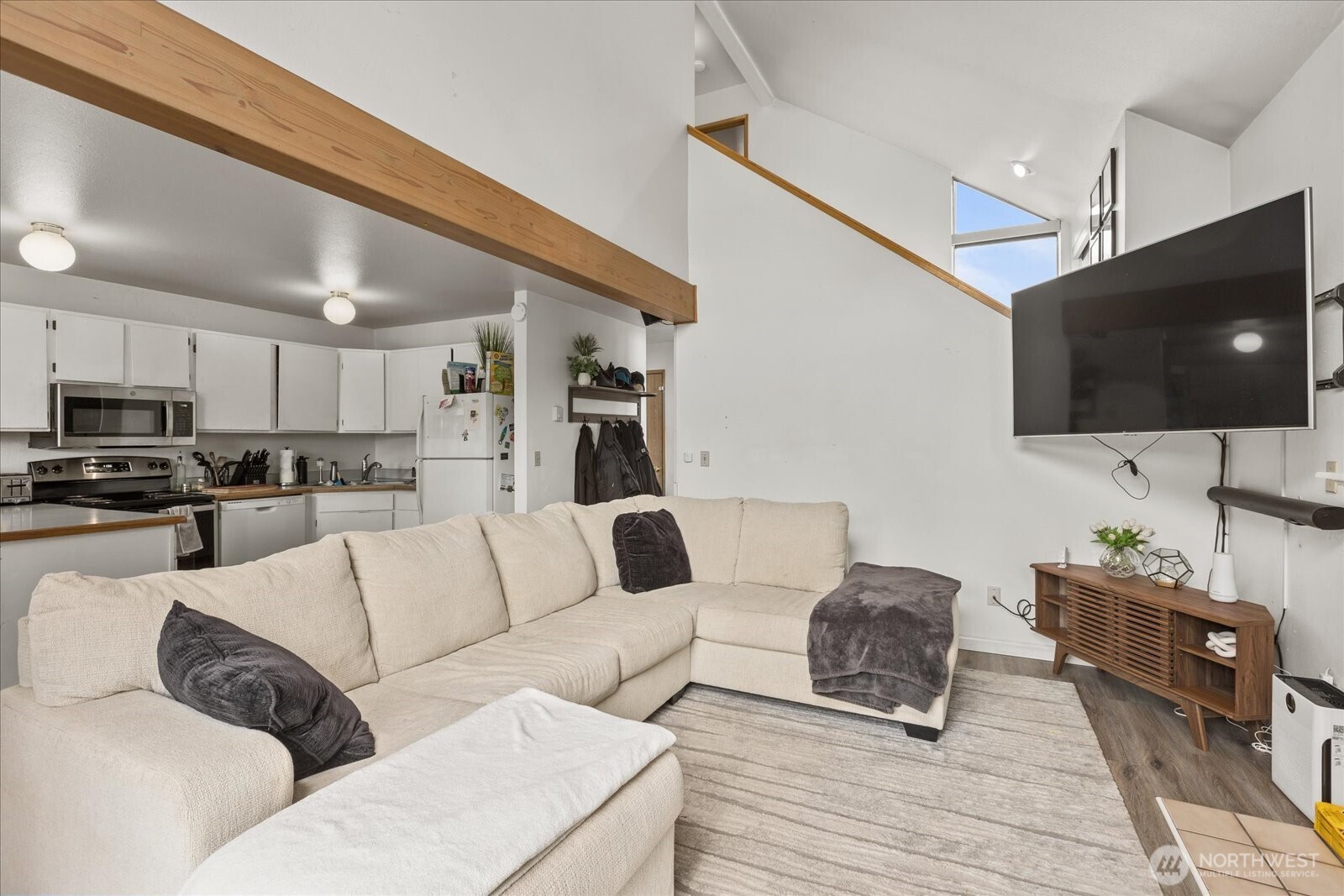2826 Northeast 8th Street Renton, WA 98056 - Photo 5 of 20 a living room with furniture and a flat screen tv