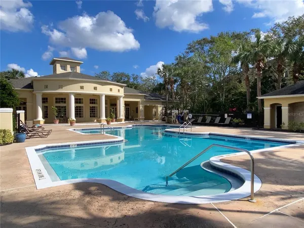 a view of a house with swimming pool