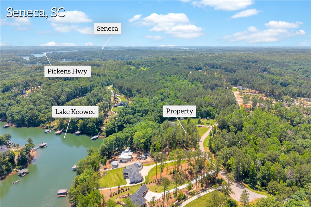 Lot 60 Harbor Point Seneca, SC 29672 - Photo 15 of 30 Discover expansive acreage with abundant tree coverage, bordered by serene lake waters.