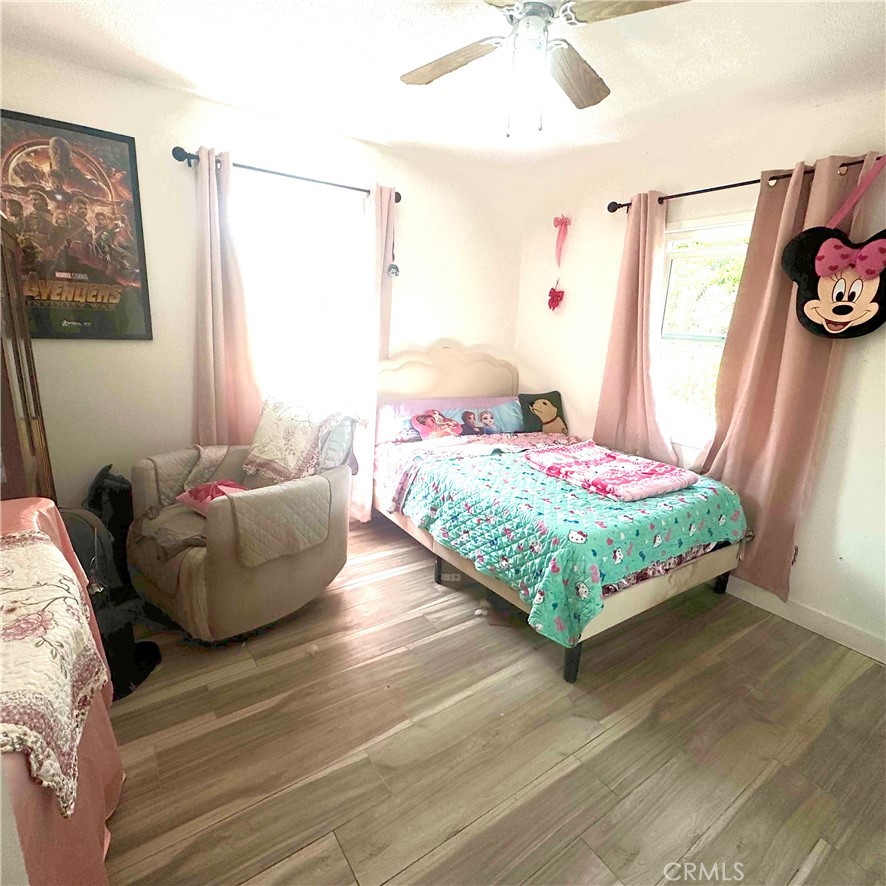 5642 Babb Avenue Riverside, CA 92503 - Photo 11 of 41 a bedroom with a bed and a couch