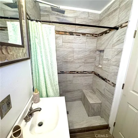 a bathroom with a shower and a window