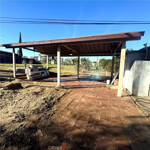 a view of a backyard with wooden floor