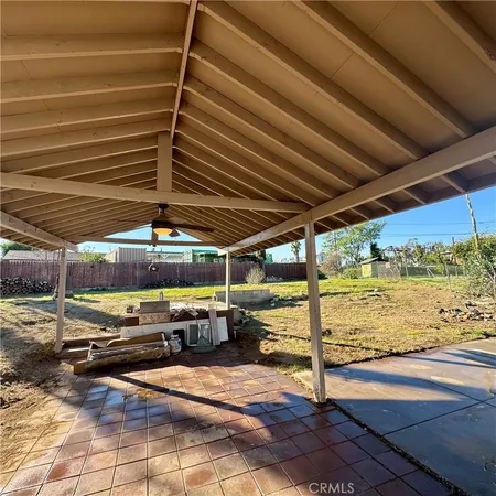 a view of a backyard with wooden floor