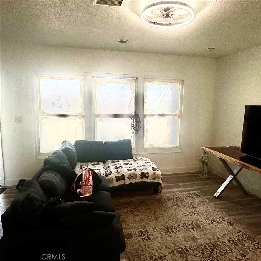 5642 Babb Avenue Riverside, CA 92503 - Photo 8 of 41 a bedroom with a bed and a window