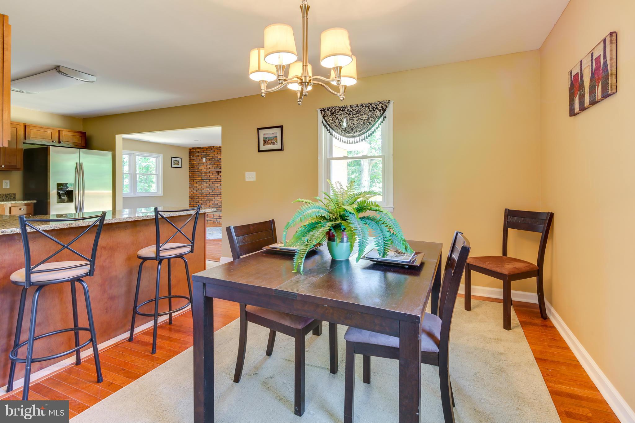 3036 Warehime Road Manchester, MD 21102 - Photo 6 of 30 a view of a dining room with furniture and chandelier