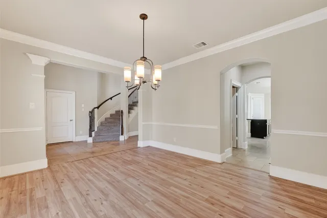 a bathroom with a sink vanity granite tub and a mirror