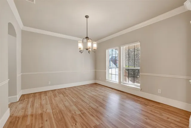 a bathroom with a granite countertop tub sink and mirror
