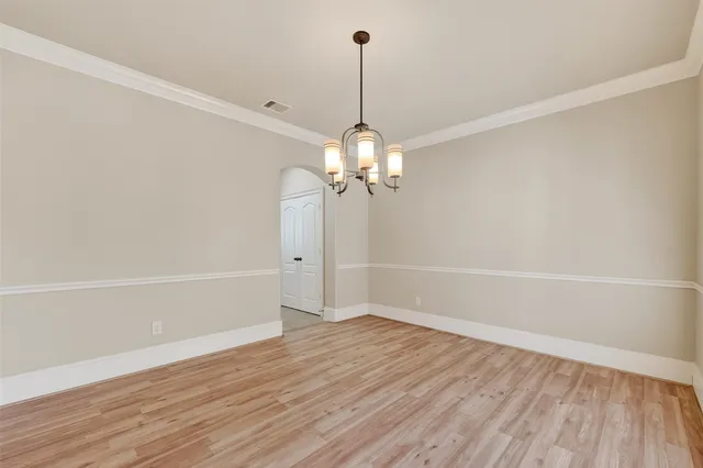 a bathroom with a bathtub and a window