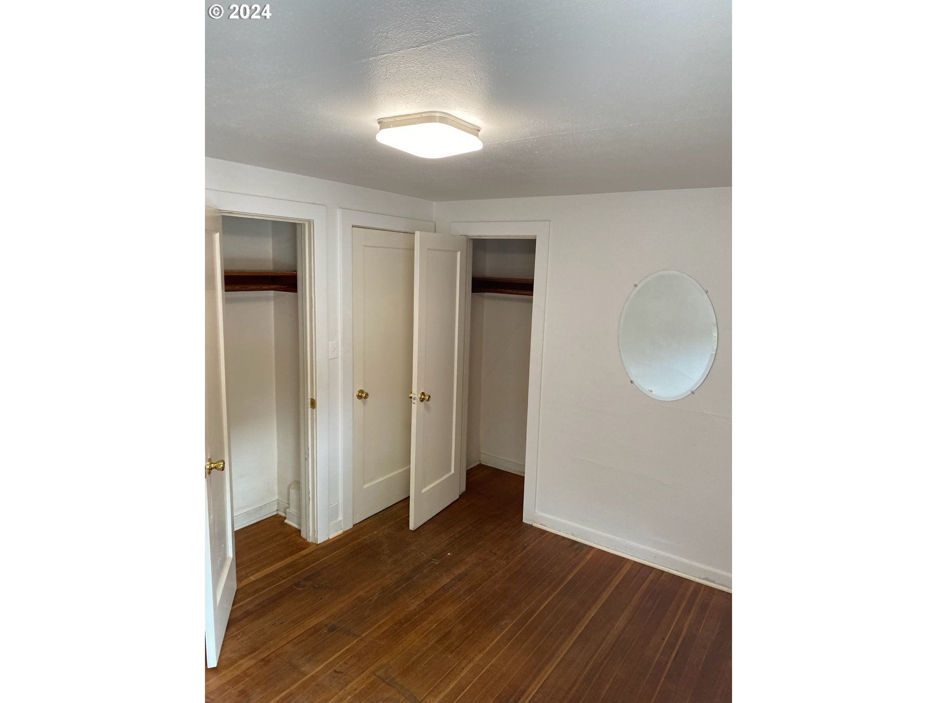1408 Ferry Street Eugene, OR 97401 - Photo 17 of 20 a view of an empty room with wooden floor