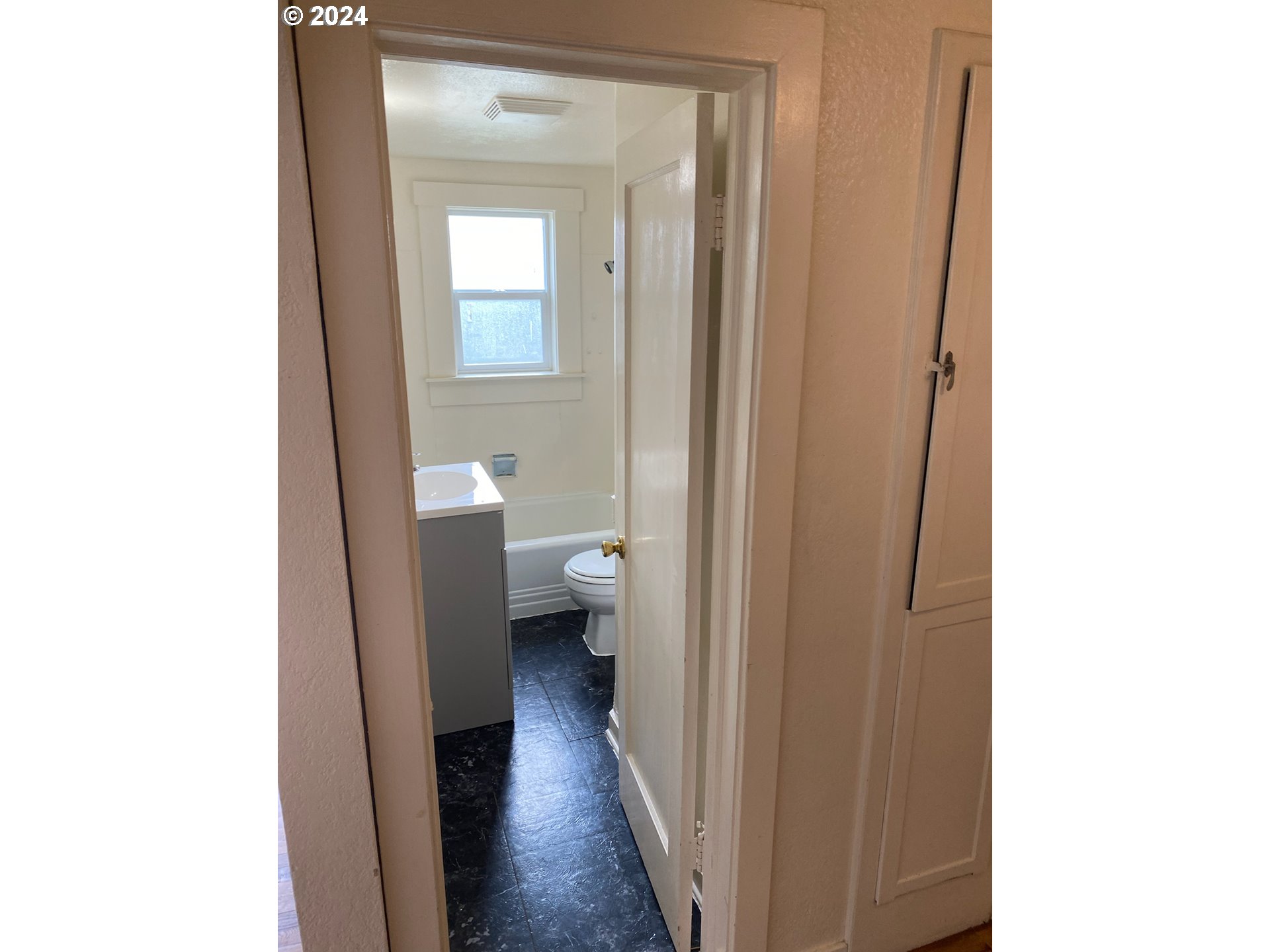 1408 Ferry Street Eugene, OR 97401 - Photo 18 of 20 a view of a bathroom from a hallway