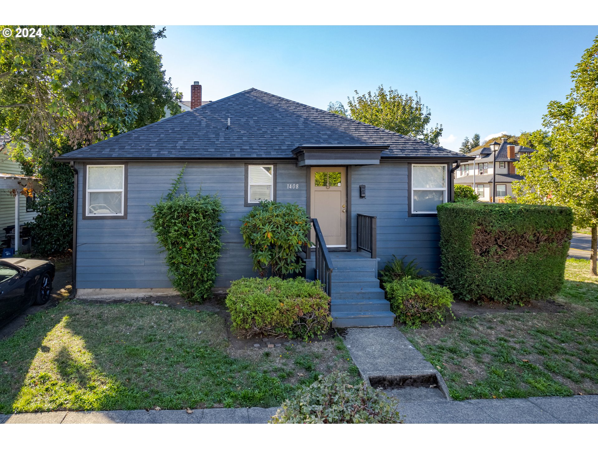 1408 Ferry Street Eugene, OR 97401 - Photo 2 of 20 a front view of a house with a yard and garage