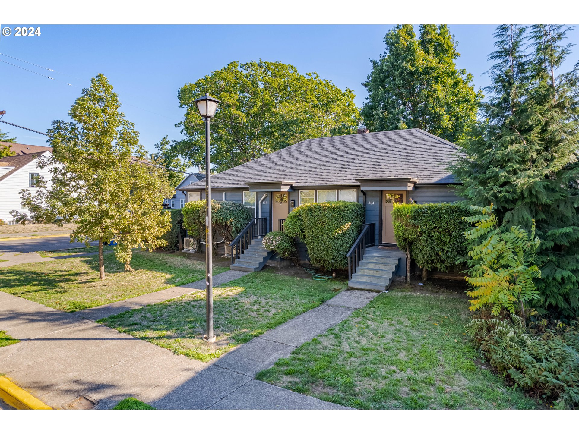 1408 Ferry Street Eugene, OR 97401 - Photo 6 of 20 a view of a house with a yard and tree s