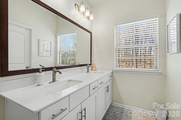 a bathroom with a sink and a window