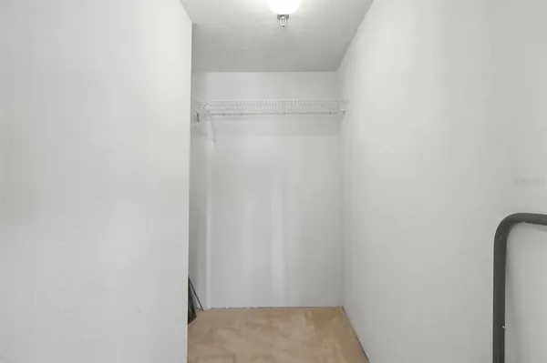 a view of a livingroom with a ceiling fan and window