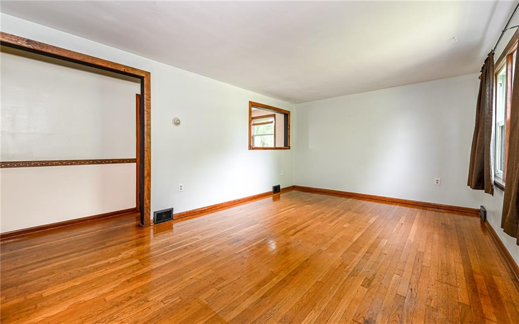2760 Ridge Rd Extension Baden, PA 15005 - Photo 2 of 23 a view of empty room with wooden floor and fan
