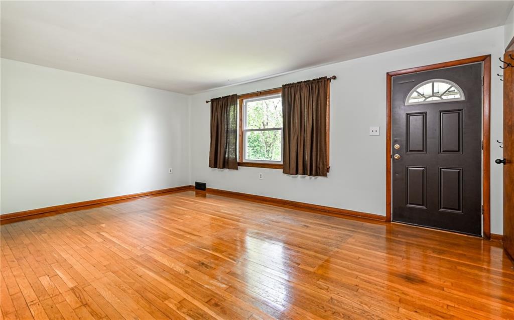 2760 Ridge Rd Extension Baden, PA 15005 - Photo 3 of 23 a view of empty room with wooden floor and fan