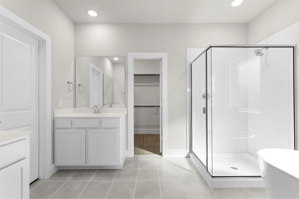2359 Bell Way Forney, TX 75126 - Photo 12 of 31 a bathroom with a shower sink and mirror