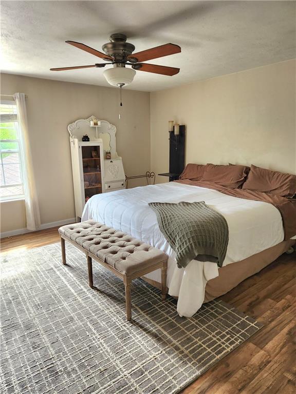 2000 Arbor Ridge Court Cheswick, PA 15024 - Photo 12 of 26 a bedroom with a bed and wooden floor