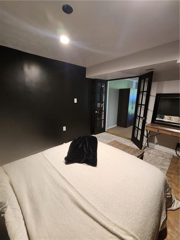 2000 Arbor Ridge Court Cheswick, PA 15024 - Photo 20 of 26 a bedroom with a large bed and a flat tv screen on dresser