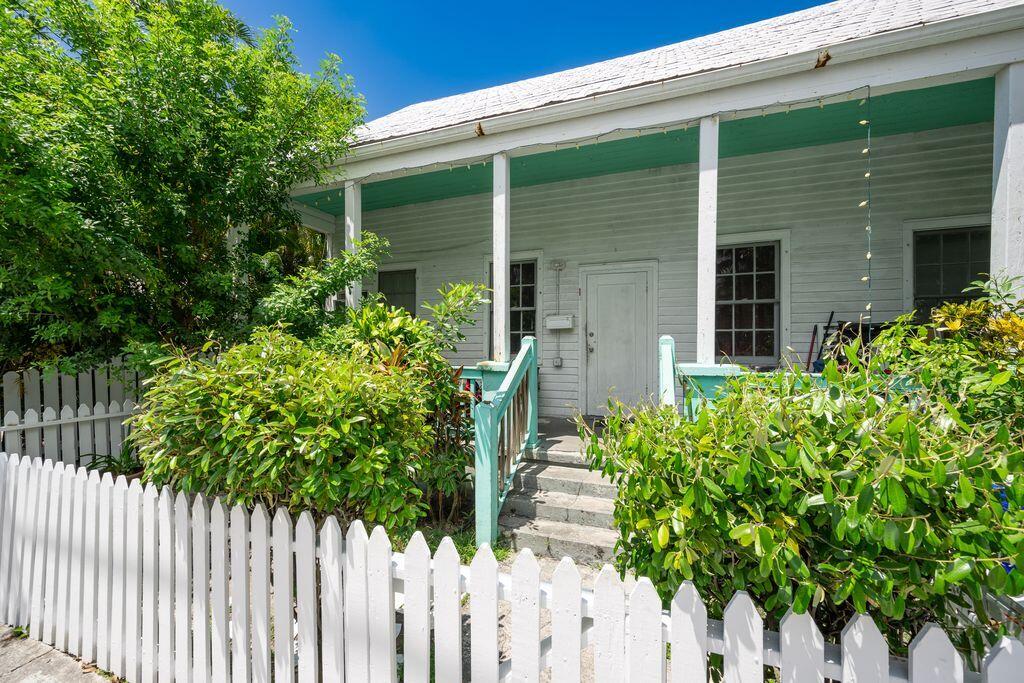 818 Elizabeth Street, Unit FRONT Key West, FL 33040 - Photo 2 of 4 a house view with a garden
