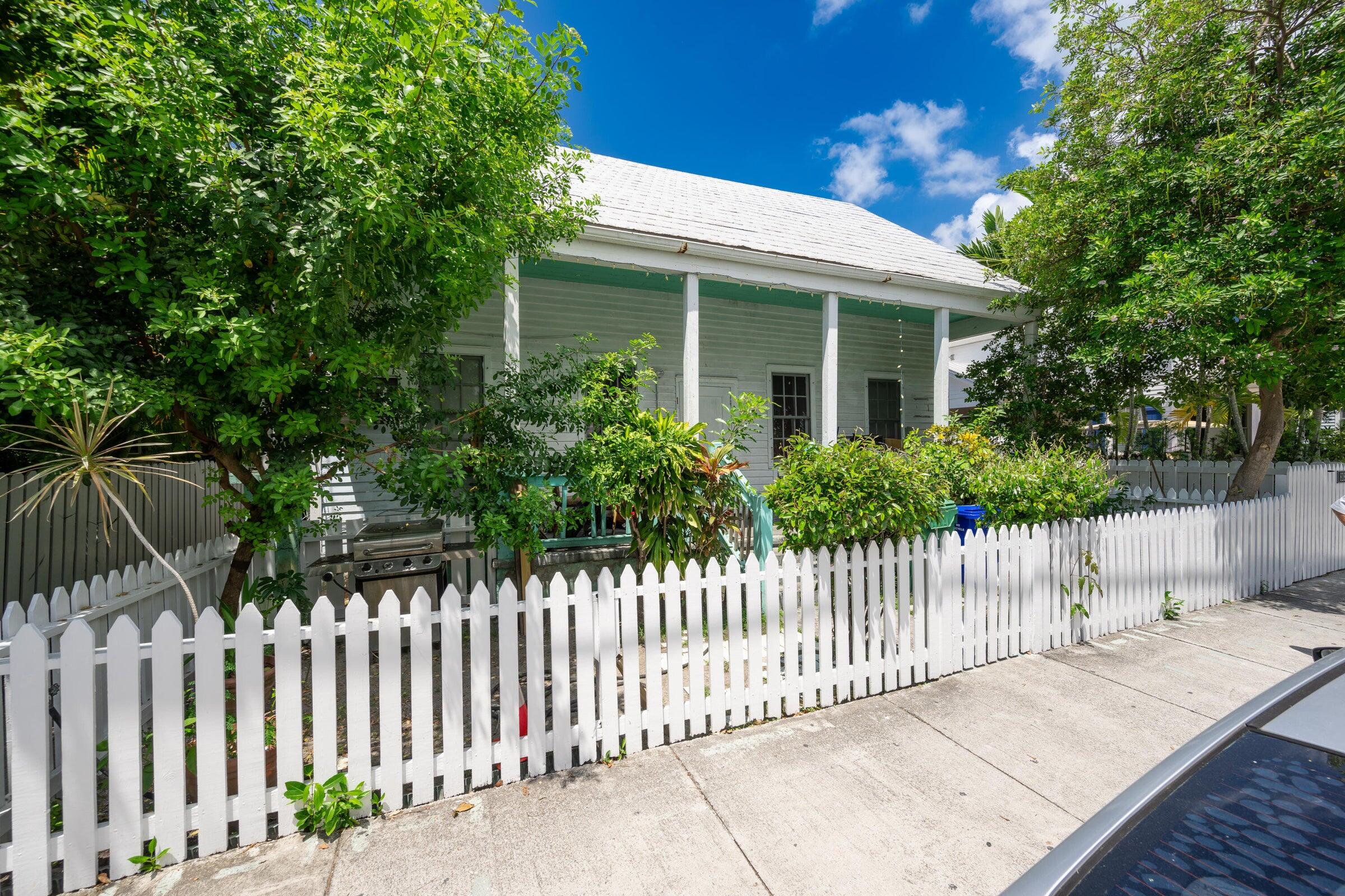 818 Elizabeth Street, Unit FRONT Key West, FL 33040 - Photo 3 of 4 a front view of a house with a garden