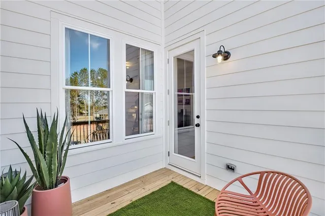 a view of front door and potted plants